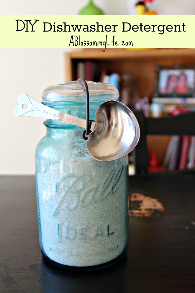 homemade dishwasher detergent in a vintage teal mason jar with a heart shaped tbs