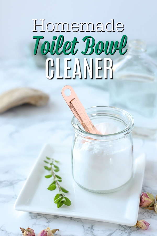 homemade toilet bowl cleaner in a glass dish with a copper spoon on a white plate