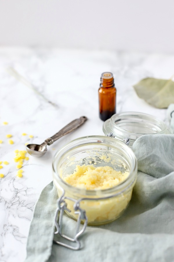 diy pomade in a glass container with a blue napkin