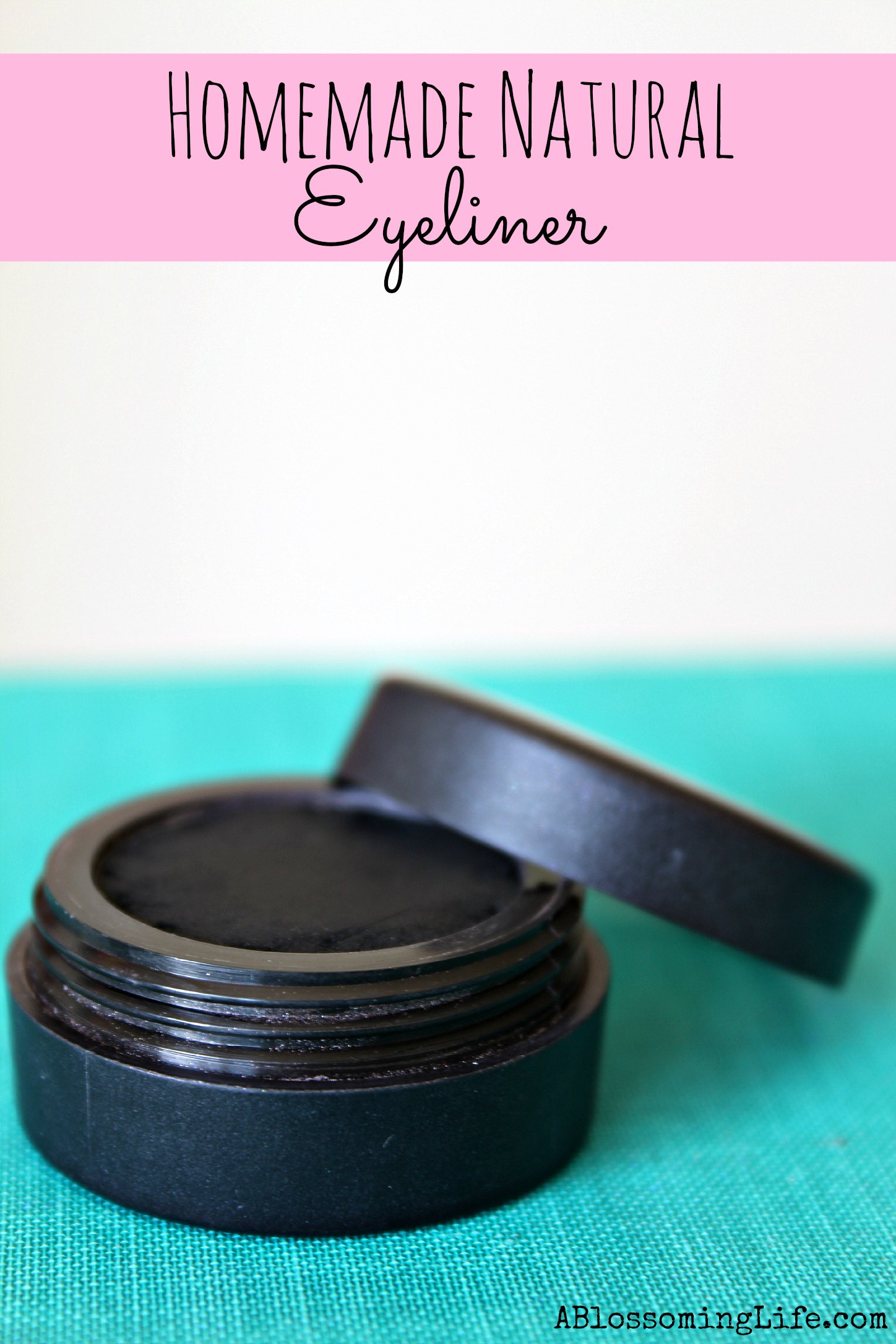 DIY eyeliner in a eyeshadow tin on a teal placemat