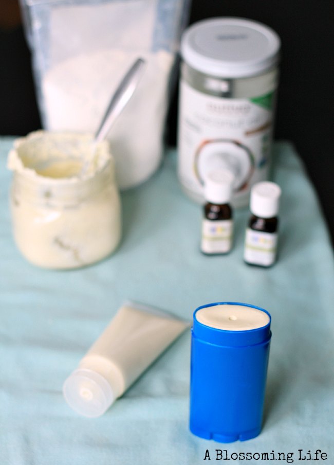 Homemade Sunscreen in a deodorant tube and squeeze tube with ingredients behind it