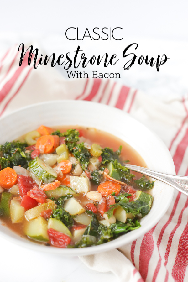 bowl of classic minestrone soup with bacon in a white bowl with a red and tan stripped towel