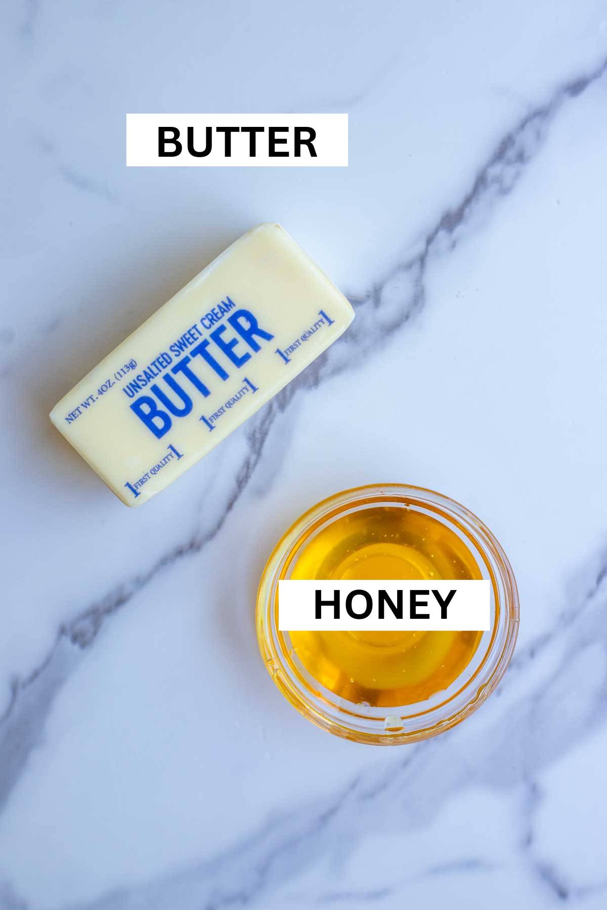 Honey and butter on a countertop.