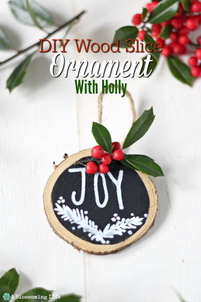  Wood Ornaments with holly and twine on a white board with holy behind it