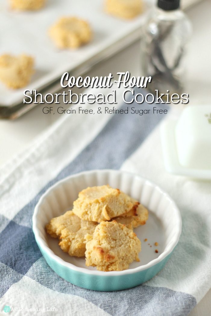 gluten free shortbread cookies in a teal tart dish on a blue and white towel