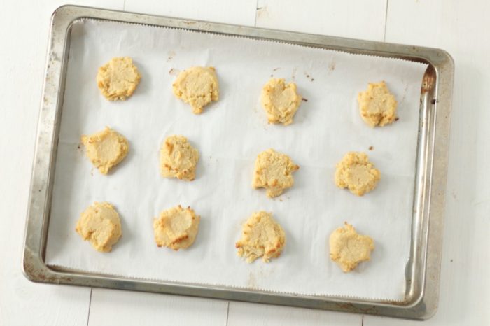 gluten free shortbread cookies on a parchment lined cookie sheet