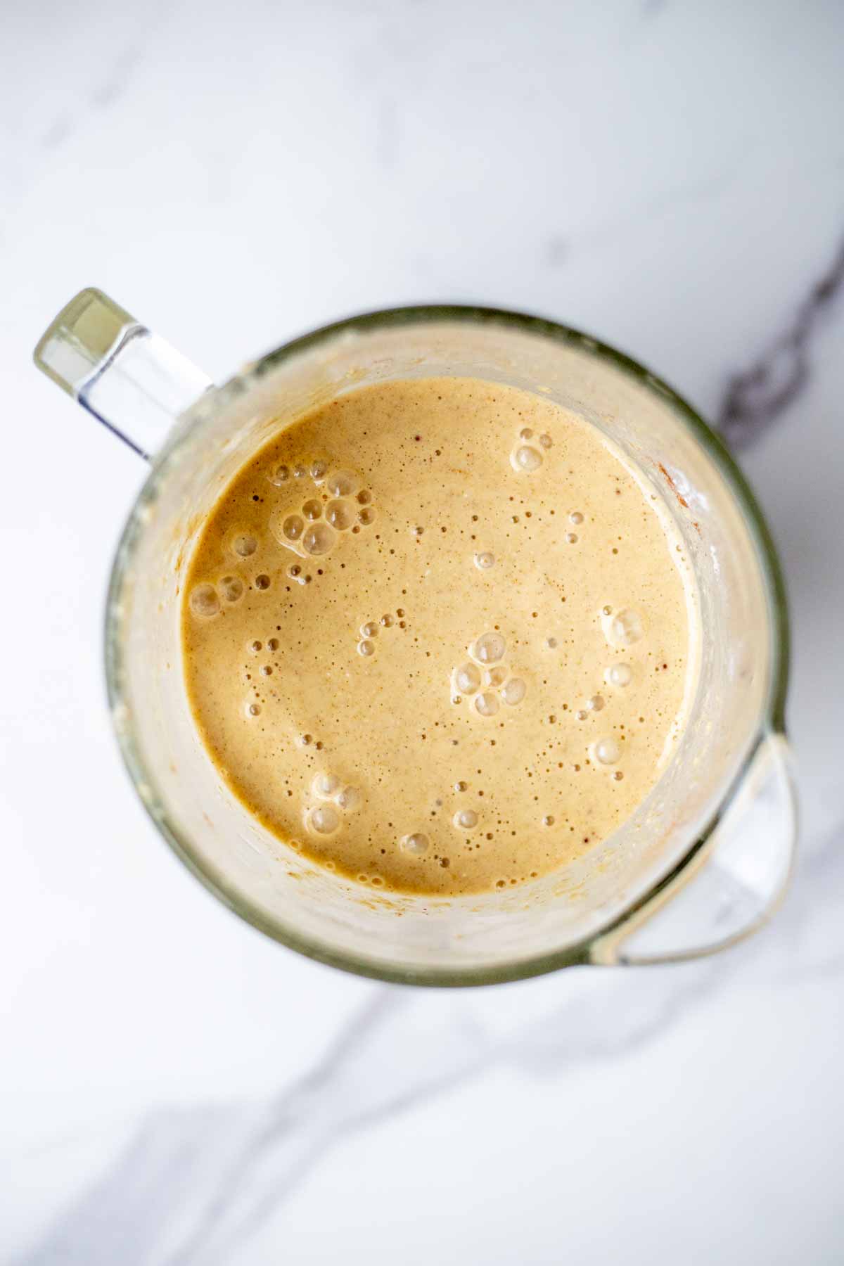 Banana oat pancake batter blended in a blender.