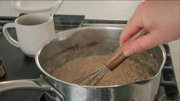 Whisking oatmeal together.