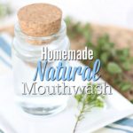 homemade mouthwash in a class jar on top a white plate with a flower