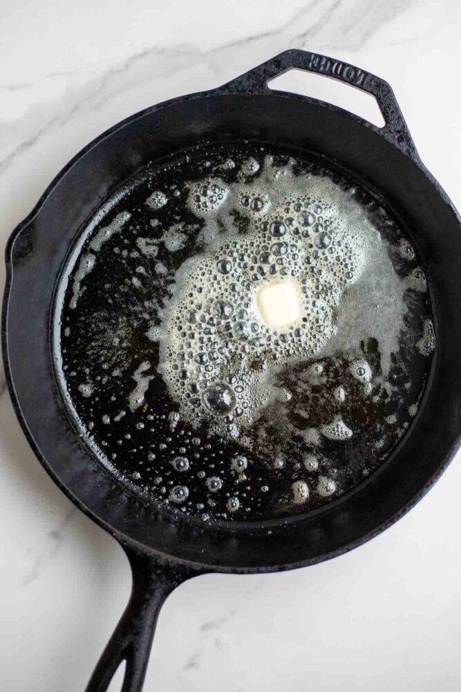 Butter in a cast iron skillet.