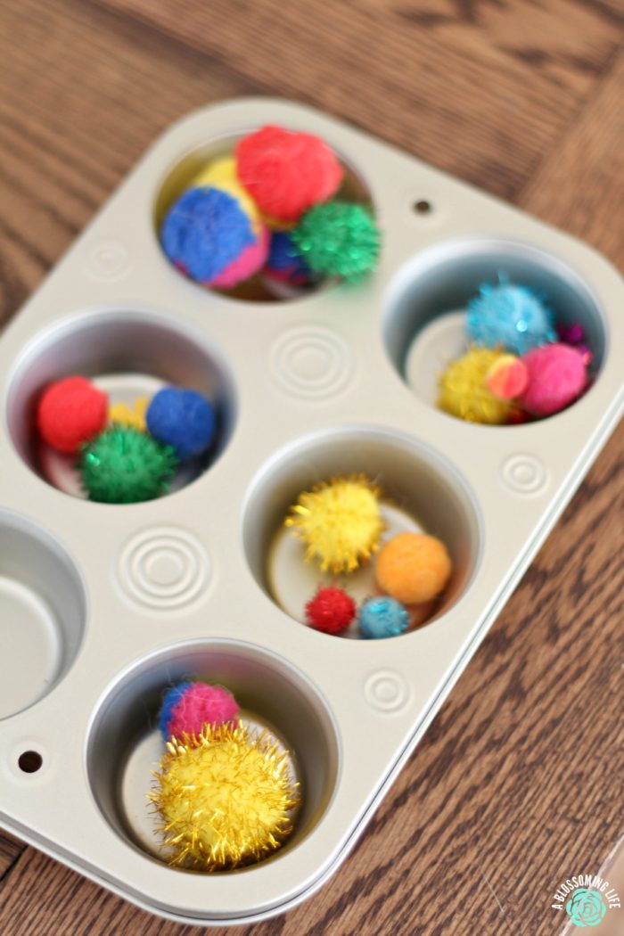 muffin tin with craft balls for homeschool preschool sorting lesson 