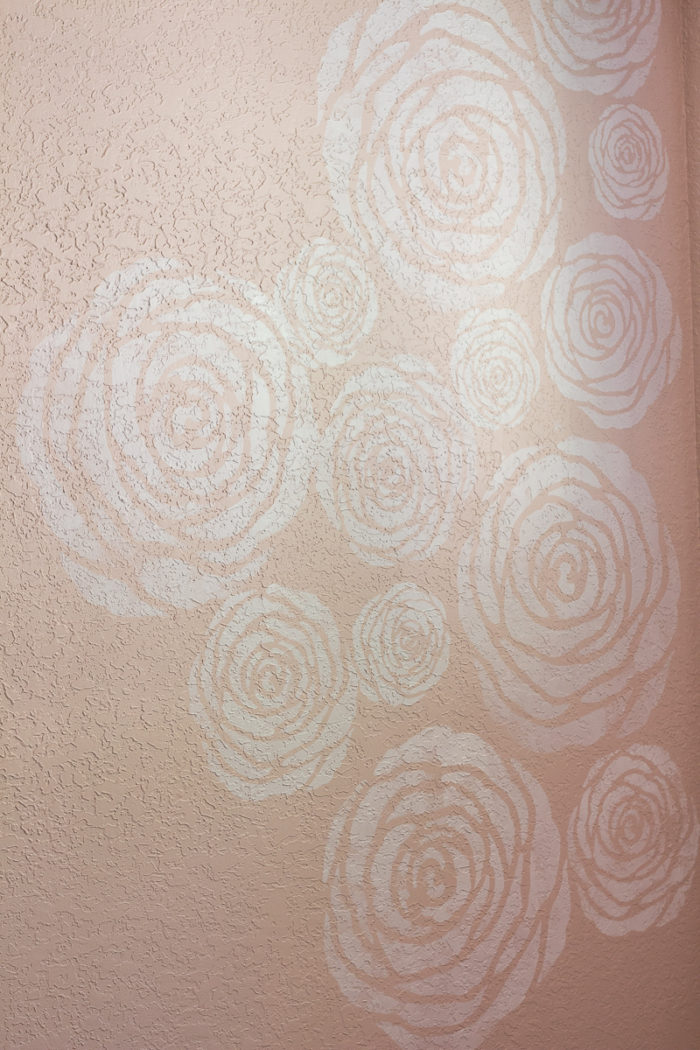 DIY stenciled flowers on a wall