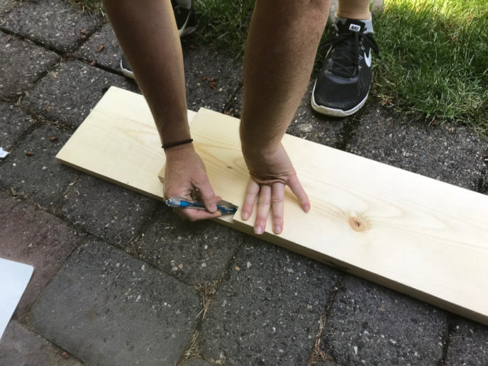 measuring wood for DIY fireplace mantel