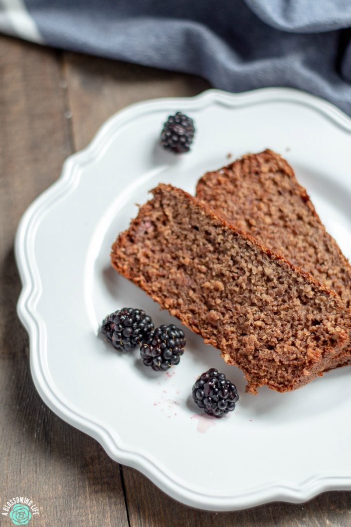 This blackberry banana breakfast bread has a hearty oat texture and a light blackberry flavor that is perfect topped with butter and a drizzle of honey. It is also protein-packed, gluten-free, and has no refined sugar.