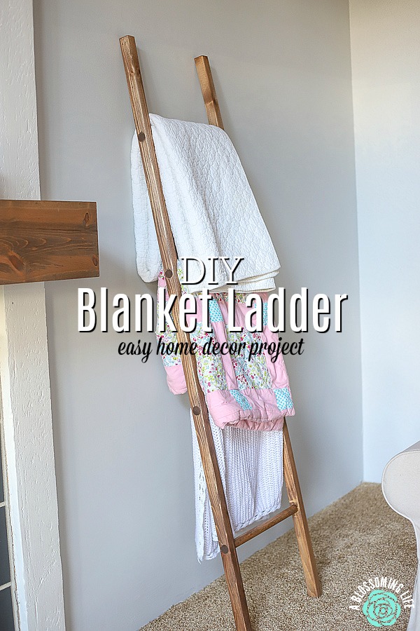 DIy blanket ladder with blankets resting on it against the wall
