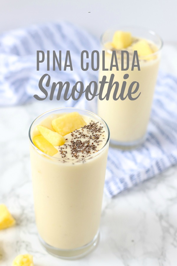 pina colada smoothie recipe in two glass cups topped with chia seeds and pineapples and placed on a blue and white napkin.