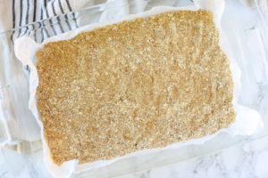 oatmeal crust in a glass baking dish on top of white towel