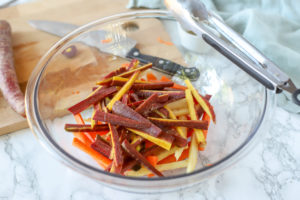 colorful carrots in a glass bowl to make carrot fries