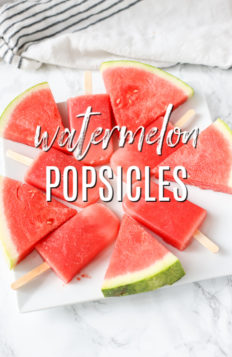 watermelon popsicles on a white plate with watermelon