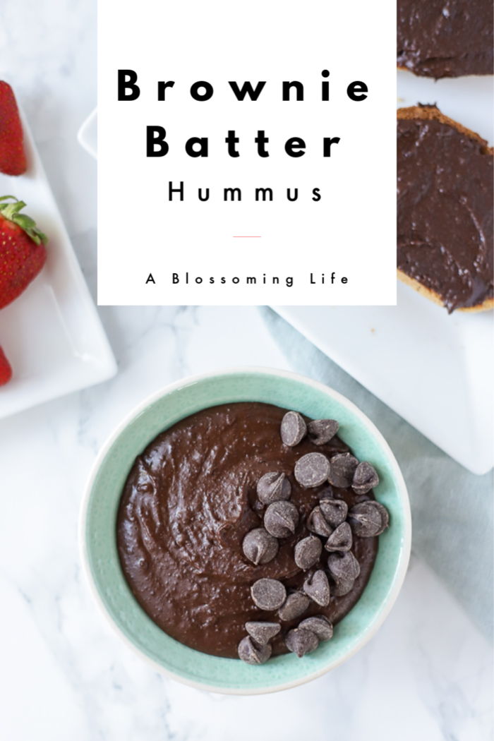 bowl of brownie batter hummus with chocolate chips on a marble counter
