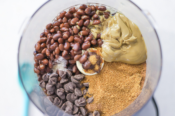 ingredients to make chocolate hummus in a food processor