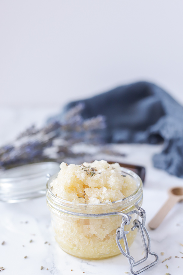 jar of homemade foot scrub with a blue napkin behind it.