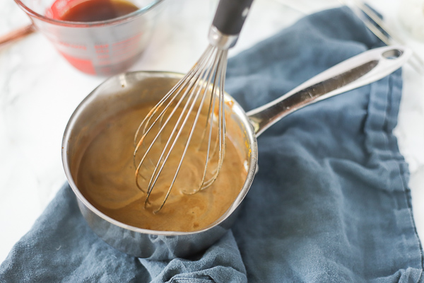 whisking together ingredients to make pumpkin spice creamer for a vegan pumpkin spice latte