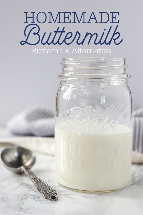 homemade buttermilk in a antique mason jar with a antique measuring spoon to the left