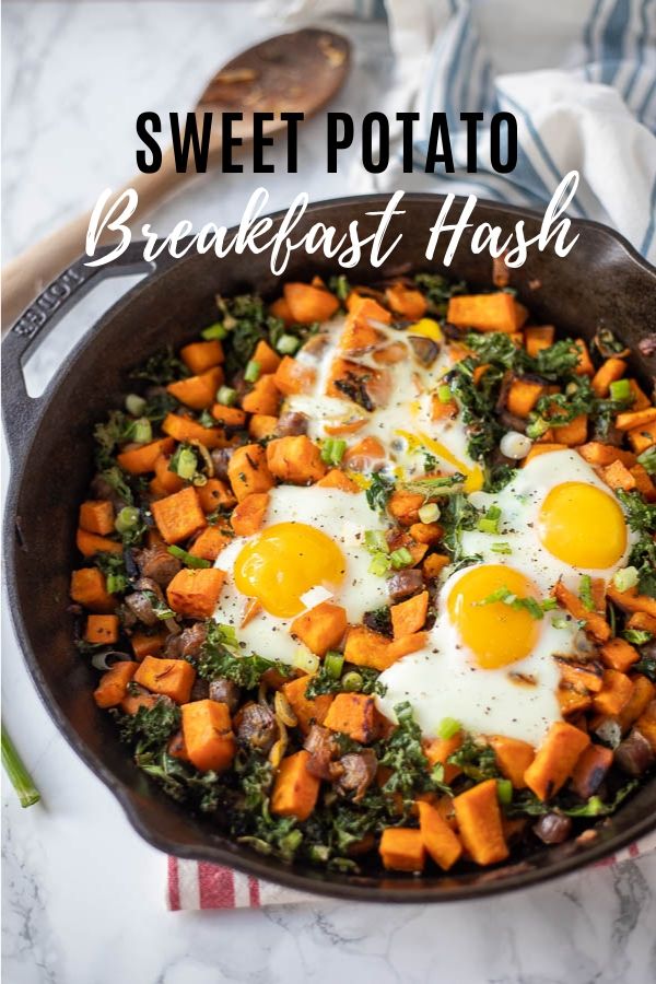 sweet potato breakfast hash in a cast iron skillet topped with eggs