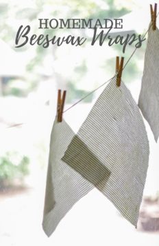 Beeswax wraps hanging with clothes pins on twine in a window
