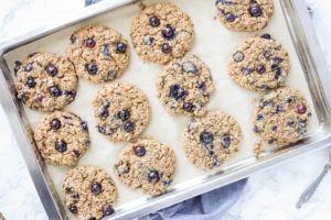 baked blueberry oatmeal cookies on a baking sheet