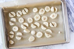 frozen banana chopped and on a parchment lined baking sheet