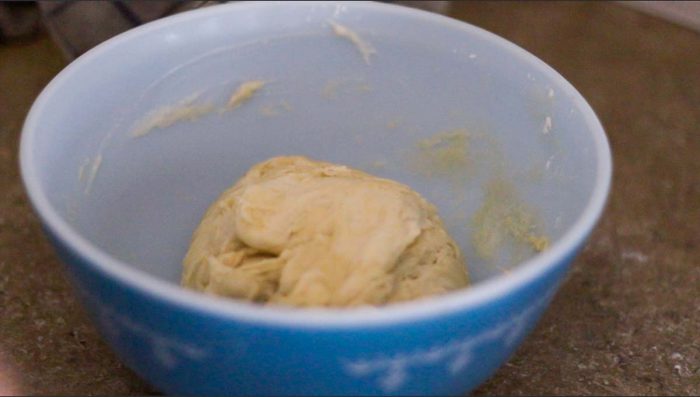 sourdough biscuit dough in a blue antique bowl 