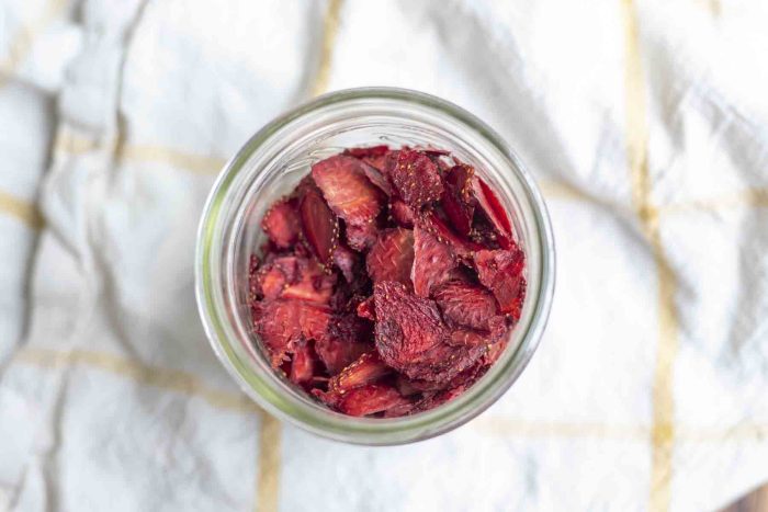overhead photo of a jar filled with dried strawberries