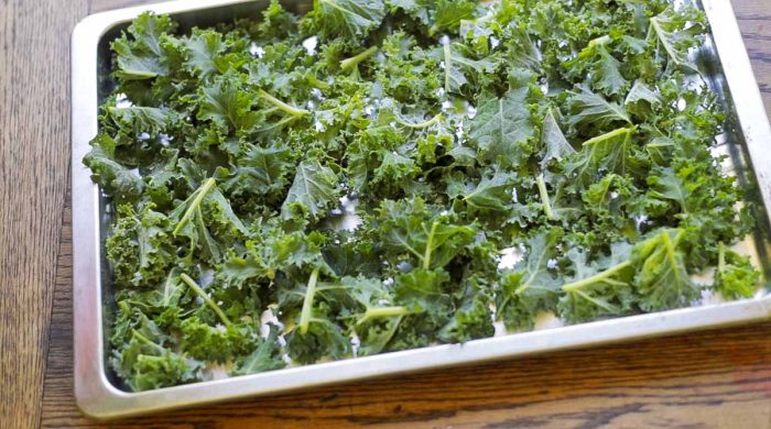 kale on a baking sheet ready for the freezer