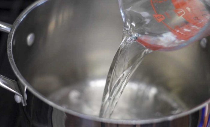 water being poured into a pot
