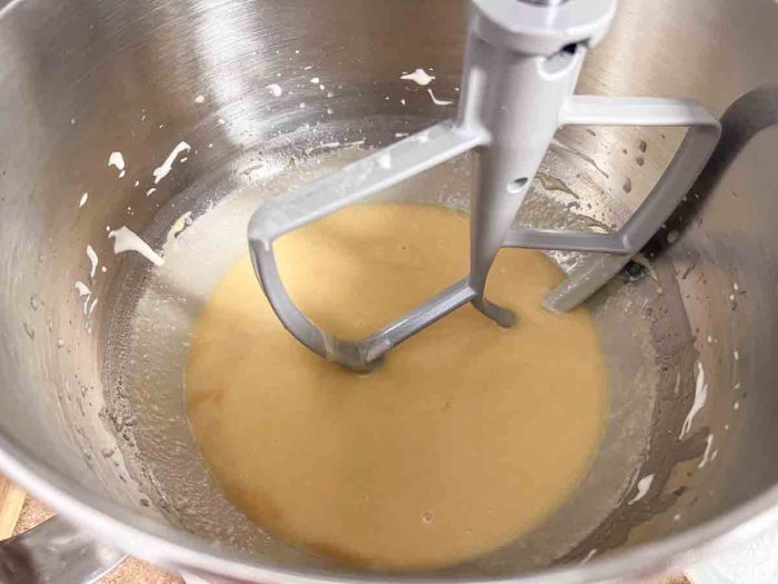 butter, sugar, eggs, and sourdough starter in a stand mixer bowl