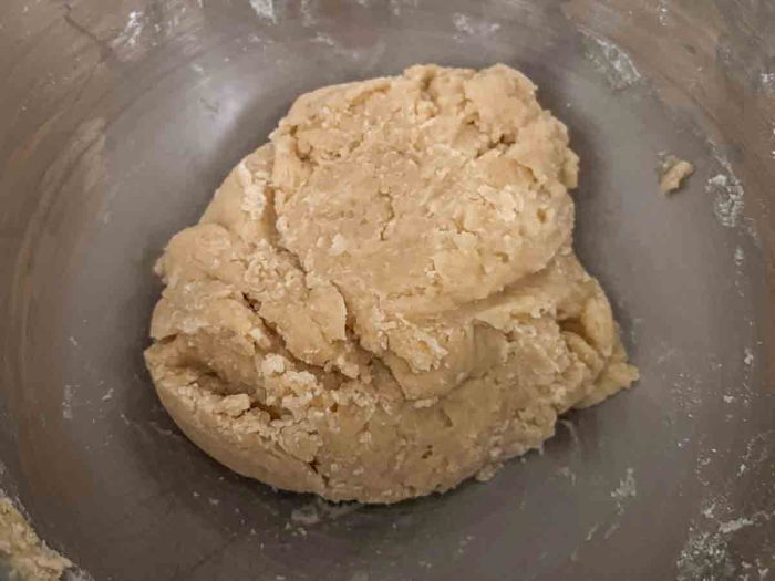 sourdough apple muffin dough ball in a stand mixer bowl