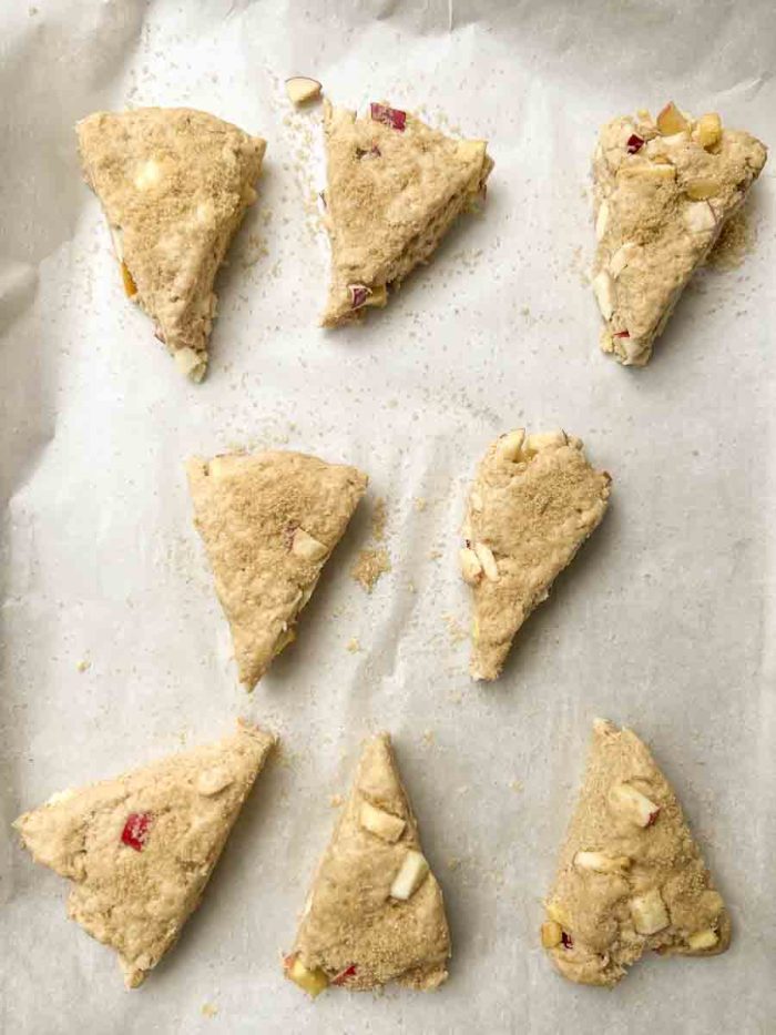 raw sourdough scones cut in wedges and placed on a parchment lined baking sheet