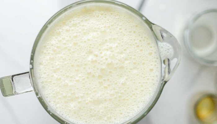 Raw eggnog blended in a blender.