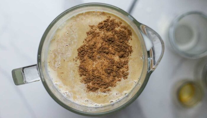 eggs, milk, cream, cinnamon and more in a blender.