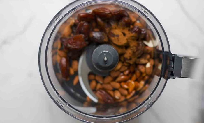 dates, almonds, spices, salt, and oil in a food processor