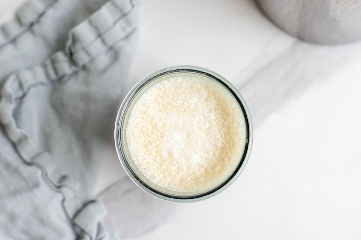 overhead photo of cold foam in a glass jar.