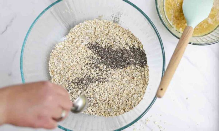 chia seeds and oats in a large glass bowl on a white countertop