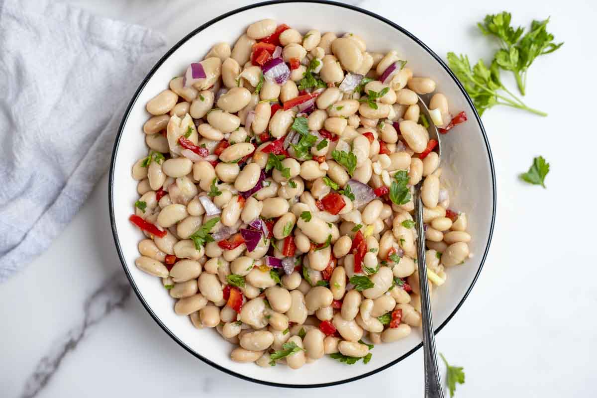 overhead photo of a bowl of white bean salad.