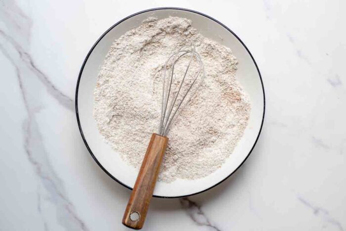 Mixing dry ingredients in a bowl.