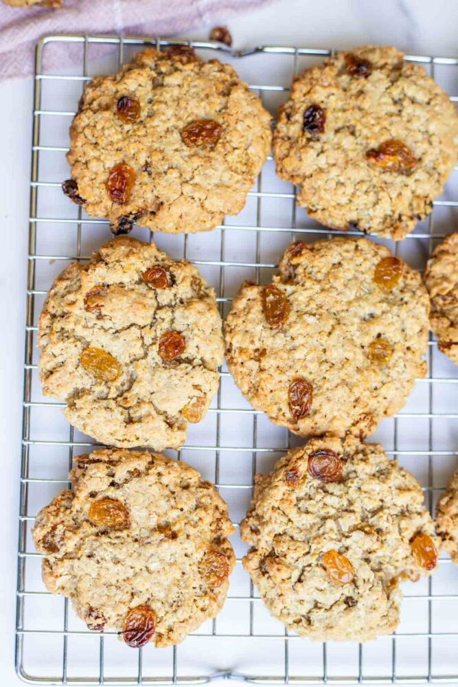 Sourdough oatmeal cookies cooling on a baking rack.