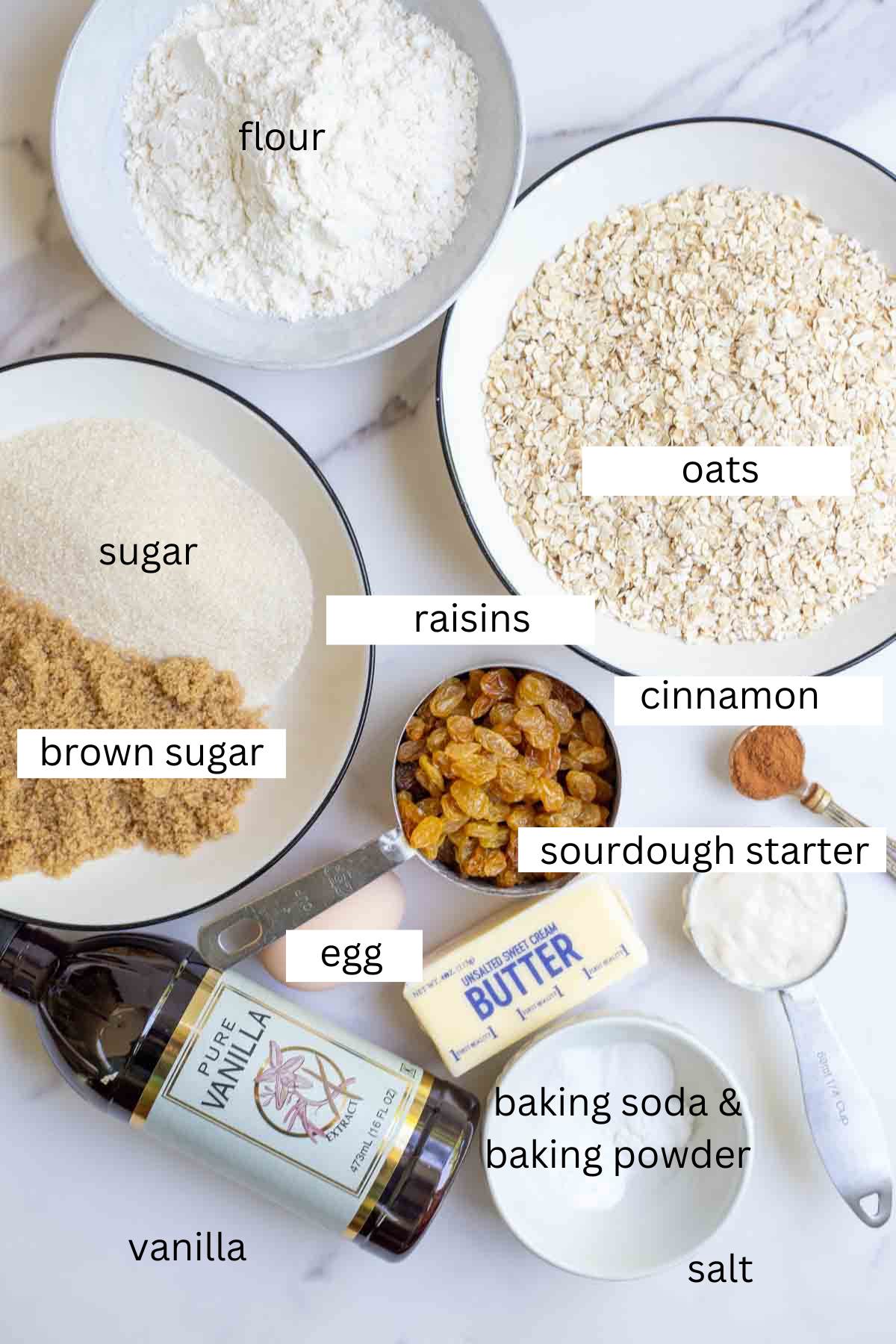 oats, flour, brown sugar and regular sugar in bowls with other ingredients surrounding the bowls.