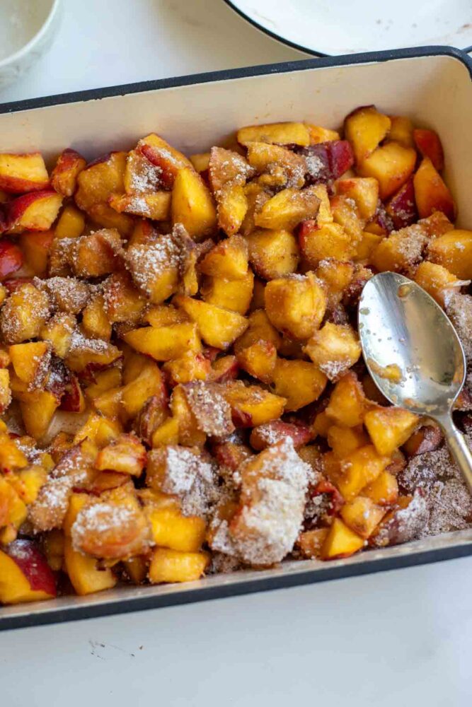 Chopped peaches topped with cornstarch, cinnamon, and sugar.