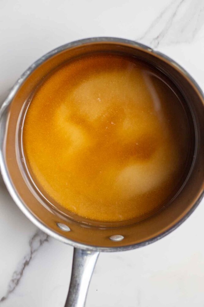 Maple syrup, water, and sugar in a small saucepan.